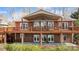Brick home with a spacious deck and covered patio, perfect for outdoor entertaining at 4633 River Bluff Ct, Charlotte, NC 28214