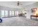 Expansive living room with access to the outdoor patio and seamless flow to the kitchen at 4633 River Bluff Ct, Charlotte, NC 28214