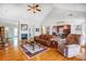 Bright living room featuring a fireplace, high ceilings, and view into the dining room at 4633 River Bluff Ct, Charlotte, NC 28214