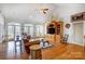 Spacious living room with high ceilings, hardwood floors, built-in shelving and beautiful natural light at 4633 River Bluff Ct, Charlotte, NC 28214