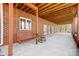 Covered patio area featuring a porch swing and ceiling with exposed beams at 4633 River Bluff Ct, Charlotte, NC 28214