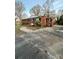 Charming one-story brick home with a concrete driveway and a well-maintained front yard at 502 Mcconnell St, Clover, SC 29710