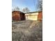 View of the home's brick exterior and attached garage with a white door at 502 Mcconnell St, Clover, SC 29710