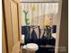 Quirky bathroom featuring a toilet and sink, highlighted by a playful shower curtain at 5434 Beckhaven Ln, Charlotte, NC 28216