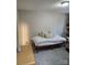 Bright bedroom featuring a daybed with neutral pillows and a modern floor lamp at 5434 Beckhaven Ln, Charlotte, NC 28216