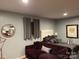 Cozy bedroom with a comfortable sofa, plush bed, and stylish decor at 5434 Beckhaven Ln, Charlotte, NC 28216