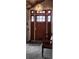 Cozy entryway featuring a stylish light fixture, a wooden bench, and a tiled floor at 5434 Beckhaven Ln, Charlotte, NC 28216
