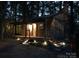 Charming cottage with a covered porch and inviting entryway, nestled amongst mature trees at 5434 Beckhaven Ln, Charlotte, NC 28216