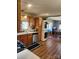 Well-equipped kitchen featuring wooden cabinetry, modern appliances, and a window over the sink at 5434 Beckhaven Ln, Charlotte, NC 28216