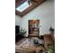 Bright and airy living room leads to the entryway with a comfortable leather couch at 5434 Beckhaven Ln, Charlotte, NC 28216