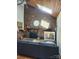 Comfortable living room features a brick fireplace with a wood mantle and a large painting at 5434 Beckhaven Ln, Charlotte, NC 28216