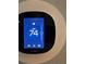 Close up of an Ecobee smart thermostat displaying a temperature of 74 degrees Fahrenheit at 5434 Beckhaven Ln, Charlotte, NC 28216