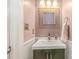 Powder room featuring vanity, mirror, and modern fixtures at 6000 Embassy Ct, Wesley Chapel, NC 28110