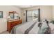 Bedroom featuring a large window and a wooden dresser with ornate mirror at 6000 Embassy Ct, Wesley Chapel, NC 28110