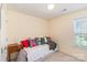 Cozy bedroom featuring bright throw pillows on a trundle bed at 6000 Embassy Ct, Wesley Chapel, NC 28110