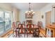 Dining room with wood table and chairs, and a floral rug at 6000 Embassy Ct, Wesley Chapel, NC 28110