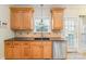 Kitchen featuring granite countertops, stainless dishwasher, and sink at 6000 Embassy Ct, Wesley Chapel, NC 28110