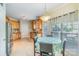 Eat-in kitchen with stainless steel appliances, granite counters, and large windows at 6000 Embassy Ct, Wesley Chapel, NC 28110