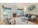 Cozy living room featuring a fireplace, hardwood floors, and plenty of natural light at 6000 Embassy Ct, Wesley Chapel, NC 28110