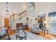 Open living room showcases high ceilings, hardwood floors, and seamless flow to other areas at 6000 Embassy Ct, Wesley Chapel, NC 28110