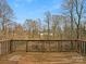 View from wooden back deck showing trees and the surrounding landscape on a sunny day at 670 Sherwood Pl, Mooresville, NC 28115