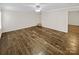 Empty bedroom featuring tile floors, neutral paint, and a ceiling fan at 670 Sherwood Pl, Mooresville, NC 28115