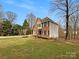 Two-story brick and siding home with mature landscaping and a well-manicured front lawn at 670 Sherwood Pl, Mooresville, NC 28115