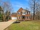 Charming brick home with a well-manicured lawn and a two-car garage, perfect for Gathering living at 670 Sherwood Pl, Mooresville, NC 28115