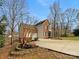 Charming two-story brick and siding home with a well-maintained lawn and mature trees at 670 Sherwood Pl, Mooresville, NC 28115
