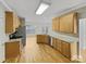 Well-equipped kitchen with granite countertops, stainless steel appliances, and hardwood floors at 670 Sherwood Pl, Mooresville, NC 28115