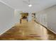 Open floor plan with kitchen view, wood floors and double doors at 670 Sherwood Pl, Mooresville, NC 28115