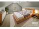 Cozy bedroom featuring a large bed, neutral decor, and lots of natural light at 670 Sherwood Pl, Mooresville, NC 28115