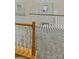 Carpeted staircase featuring traditional wooden railing and chandelier at 670 Sherwood Pl, Mooresville, NC 28115