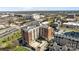 Aerial view featuring a condo building with an outdoor pool amenity near bustling city streets at 715 N Church St # 503, Charlotte, NC 28202