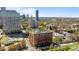 City view featuring a red brick apartment building with surrounding green spaces at 715 N Church St # 503, Charlotte, NC 28202