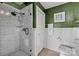 Well-lit bathroom with stylish tile shower and updated fixtures at 715 N Church St # 503, Charlotte, NC 28202