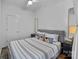Bright bedroom with a queen bed, modern decor, and ample natural light at 715 N Church St # 503, Charlotte, NC 28202