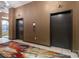 Building elevators near a colorful rug and mailboxes at 715 N Church St # 503, Charlotte, NC 28202