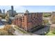 Brick apartment building with balconies, city views, and street access at 715 N Church St # 503, Charlotte, NC 28202