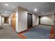 Well-lit hallway with neutral walls, carpeted floor, and elevator access, offering a clean and functional space at 715 N Church St # 503, Charlotte, NC 28202