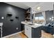 Modern kitchen featuring quartz countertops, white cabinetry, and seamless transition to the cozy living area at 715 N Church St # 503, Charlotte, NC 28202