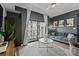 Contemporary living room with balcony, hardwood floors, and designer decor at 715 N Church St # 503, Charlotte, NC 28202