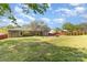 Backyard featuring a grassy lawn, patio and wooden fence at 7212 Hackberry Ln, Charlotte, NC 28226
