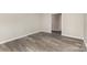 Bedroom featuring wood-look flooring and a view to the hallway at 7212 Hackberry Ln, Charlotte, NC 28226