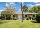 Inviting single-story home showcasing a well-maintained lawn and double door entrance at 7212 Hackberry Ln, Charlotte, NC 28226