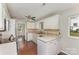 Bright kitchen with white cabinets, neutral countertops, and stainless steel appliances at 7212 Hackberry Ln, Charlotte, NC 28226