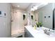 Modern bathroom with double sinks, a glass-enclosed shower, and stylish fixtures at 769 Seigle Point Dr, Charlotte, NC 28204