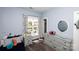 Charming bedroom with blue walls, a window, and playful decor at 769 Seigle Point Dr, Charlotte, NC 28204