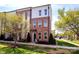 Beautiful brick townhome featuring a manicured lawn and well-maintained landscaping at 769 Seigle Point Dr, Charlotte, NC 28204