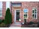 Charming front door with wreath, plants and number, creating a welcoming entrance to this lovely home at 769 Seigle Point Dr, Charlotte, NC 28204